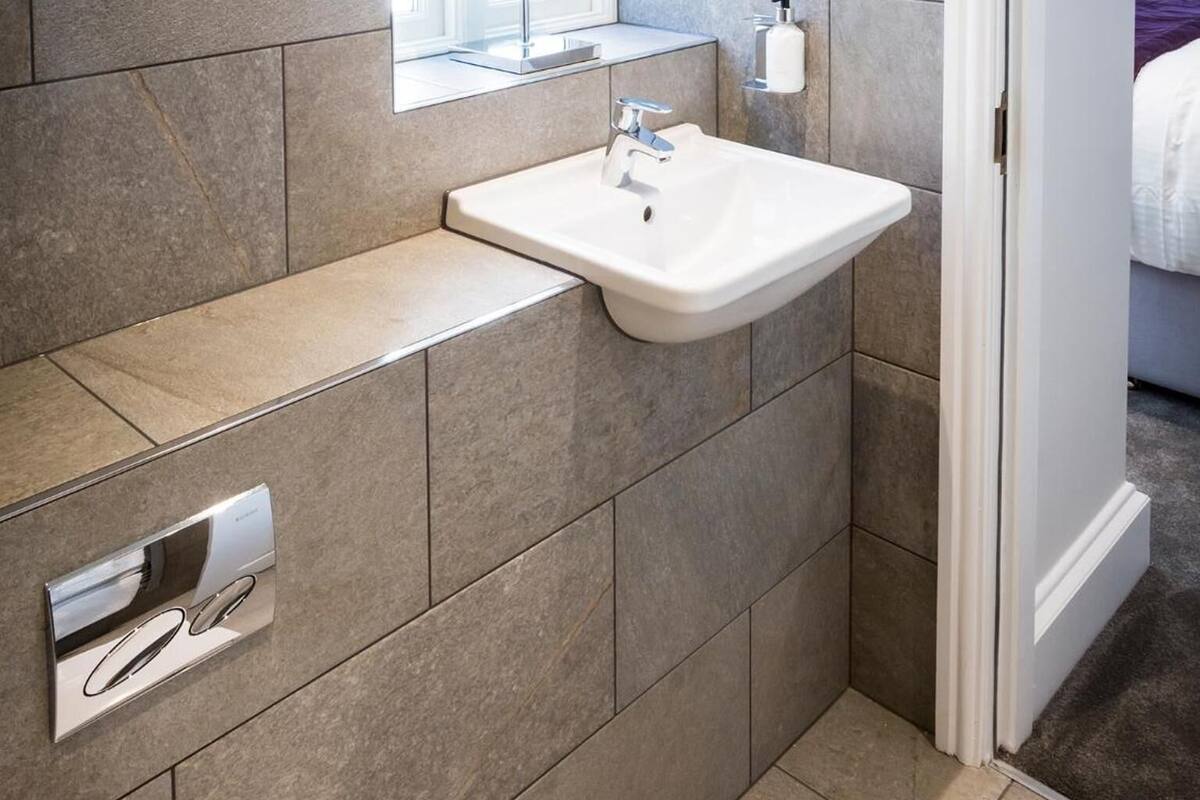 townhouse luxury suite, patio | bathroom | shower, designer toiletries, hair dryer, towels