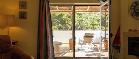 Apartment, 1 Bedroom | Living area | 40-inch flat-screen TV with cable channels, TV, fireplace