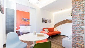 A modern room with a round table, a sofa, and a bed. - Italianway   - Ciaia (Milan)