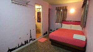 A room with a bed, a wardrobe, a mirror, and a window with curtains. - Man Lai Wah Resort (Lamma Island)