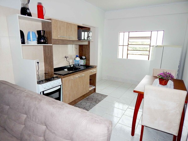 Family Apartment, 2 Bedrooms | Private kitchen | Fridge, microwave, stovetop, coffee/tea maker