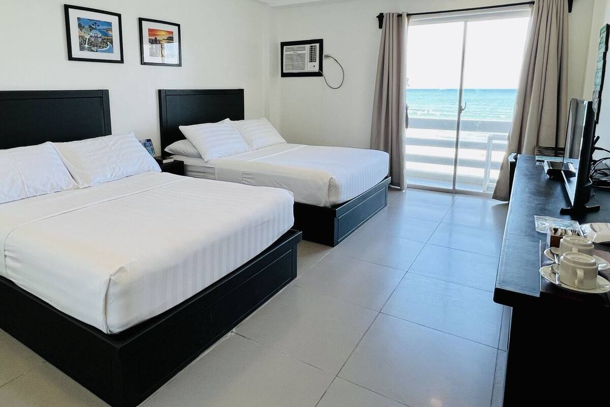 quadruple room, sea view | desk, iron/ironing board, bed sheets
