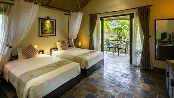 Deluxe Bungalow | Minibar, in-room safe, desk, rollaway beds