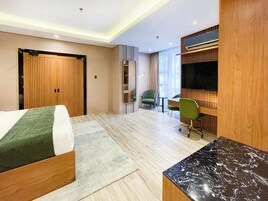Presidential Suite, City View | Living area | Flat-screen TV