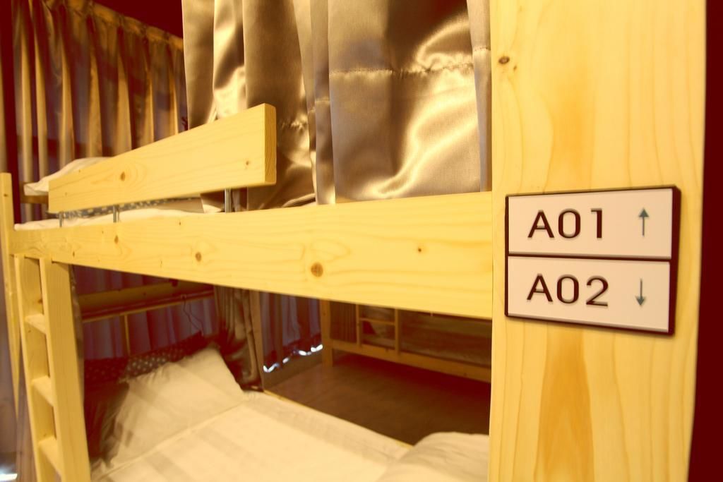 A bunk bed with two labeled sections, A01 and A02, indicating different sleeping areas.