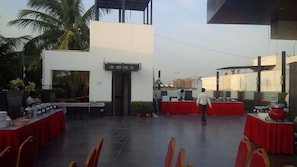 Enjoy al fresco dining in our outdoor space, surrounded by lush greenery and modern architecture.
