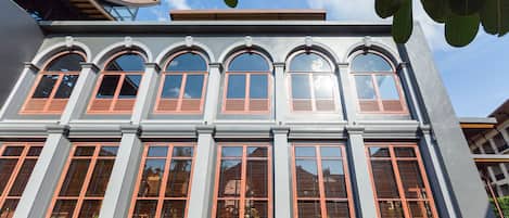 A building with multiple arched windows and a flat roof.