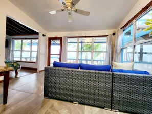 Standard Room, Terrace, Beachfront | Living area | Books - Maya Beach Hotel (Placencia)