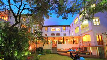 Experience a serene atmosphere in our courtyard, surrounded by lush greenery and comfortable seating areas.
