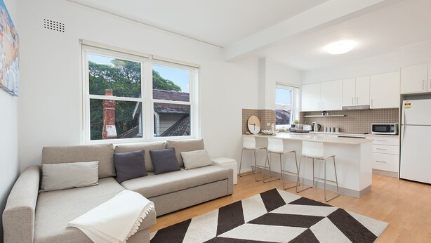 A modern apartment with a living room, kitchen, and dining area. - Central Bondi Apartment New H321 (Bondi Junction)