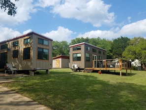 Two modern, single-story buildings with large windows and a deck area.