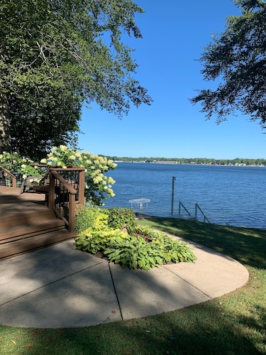 Gorgeous Sandy Beachfront Paw Paw lake home with 155 ft. of frontage and dock