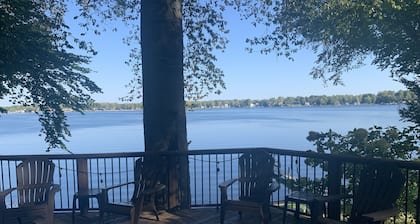Gorgeous Sandy Beachfront Paw Paw lake home with 155 ft. of frontage and dock