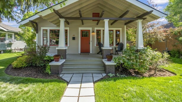 A house with a covered porch, steps leading to the front door, and a well-maintained garden. - Historic Craftsman Bungalow, Just Steps to Downtown ~HOT TUB!~ (Bend)