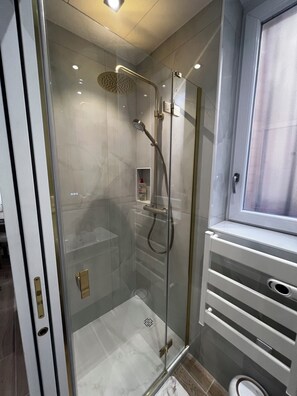 Shower, hair dryer, towels, soap