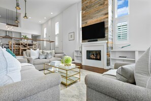 Smart TV, fireplace, books, stereo