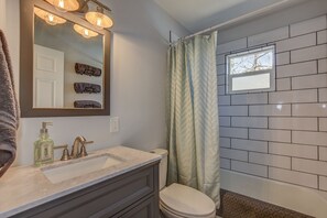 Hair dryer, towels, shampoo, toilet paper