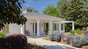 A white house with a covered porch and a small tower-like structure on the roof. - Laurel Grove, Walk to Pool, 6-Seat Golf Cart (Miramar Beach)