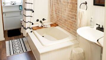 Combined shower/bathtub, hair dryer, towels, soap