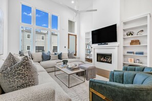 Smart TV, fireplace, books, stereo
