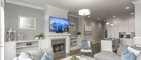 Smart TV, fireplace, books, stereo