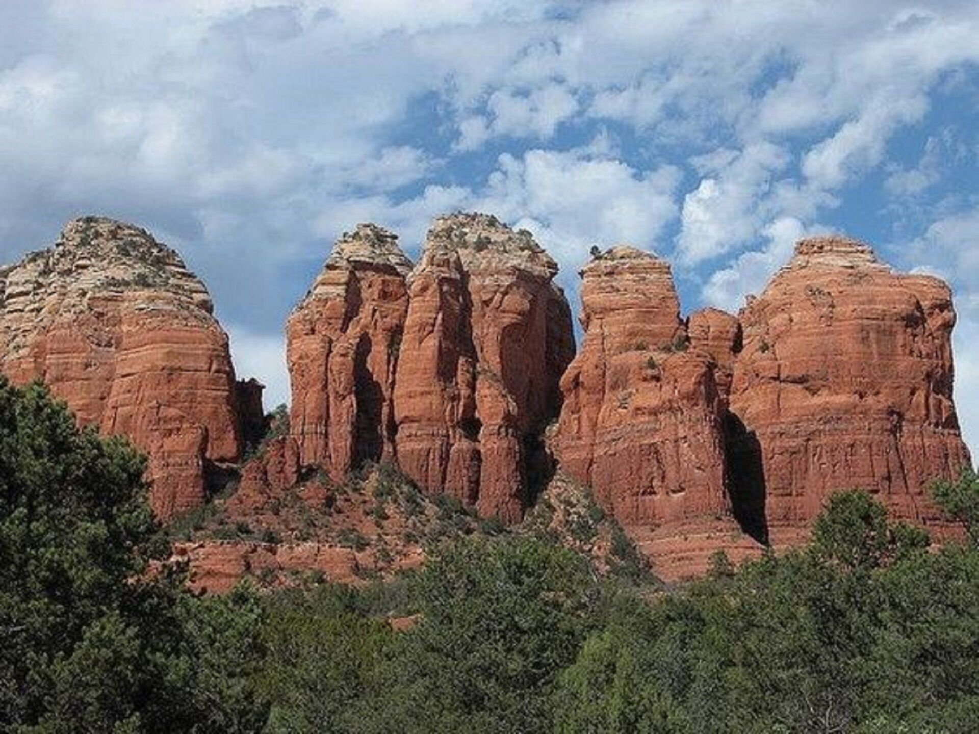 A natural rock formation with a clear sky.