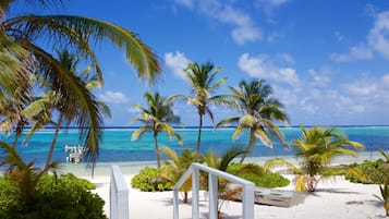 On the beach, sun loungers, beach towels