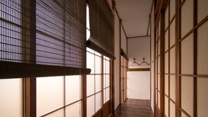 A corridor with tatami mat flooring and shoji screens. - 22alleys (Magong)
