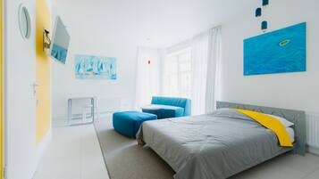 Premium bedding, memory-foam beds, desk, laptop workspace