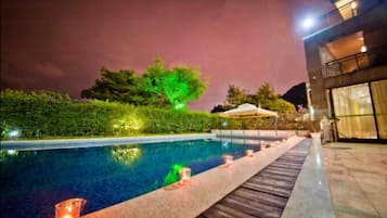 Seasonal outdoor pool, pool umbrellas, pool loungers