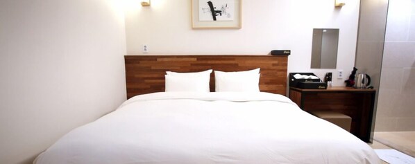 Premium bedding, down duvets, desk, laptop workspace