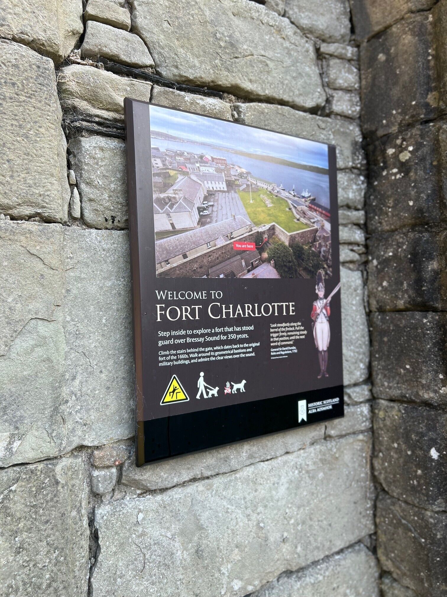 A welcome sign for Fort Charlotte, detailing its historical significance and visitor information.