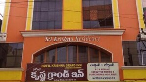 A building with a large vertical yellow column, labeled "Sri Krishna Residency." - Hotel Krishna Grand Inn (Guntur)