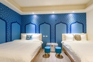 A hotel room with two beds, a small table, and a decorative wall. - X Square (Luodong)