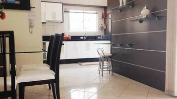 Family Apartment, Multiple Bedrooms, Balcony, Beachside | Private kitchen | Fridge, microwave, oven, stovetop