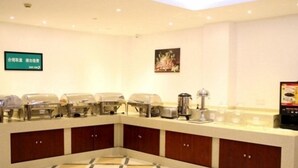 A conference room with a long table, chairs, a coffee machine, and a digital screen on the wall. - Greentree Inn Chengdu Chongzhou Shiji Avenue Longt (Chengdu)