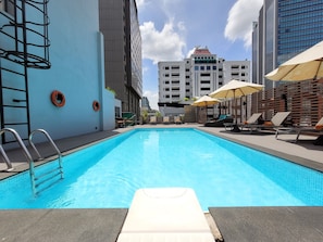 Outdoor pool, open 7:00 AM to 10 PM, pool umbrellas, pool loungers