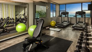 A gym with treadmills, exercise balls, and dumbbells. - Garden Court Kings Beach (Gqeberha (Port Elizabeth))