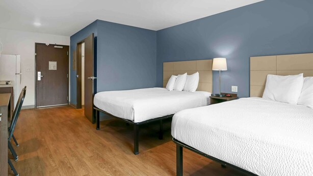 A hotel room with two beds, a desk, and a chair. - Extended Stay America Suites - Providence (Providence)