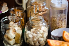 Several glass jars containing various food items, including marshmallows and nuts.