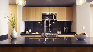 A modern kitchen with a stainless steel sink, a built-in microwave, and a gas stove. - Felix Luxury Plus by Viadora (Mexico City)