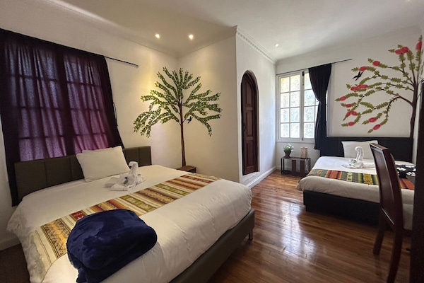 Down duvets, Select Comfort beds, desk, laptop workspace