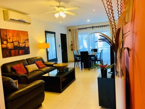 Comfort Condo, 2 Bedrooms | Living area | Flat-screen TV, DVD player, iPod dock - Condo Pacifico by Playa Paradise (Playa del Carmen)