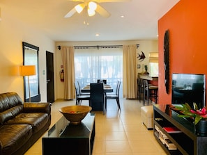 Comfort Condo, 2 Bedrooms | Living area | Flat-screen TV, DVD player, iPod dock - Condo Pacifico by Playa Paradise (Playa del Carmen)