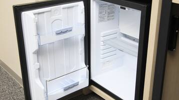 An open refrigerator with multiple shelves and compartments.