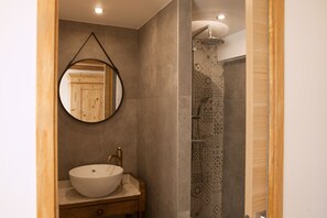 Shower, hair dryer, towels, toilet paper