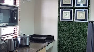 Condo, 2 Bedrooms | Private kitchen | Full-sized fridge, microwave, stovetop, electric kettle