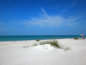 On the beach, sun-loungers, beach towels