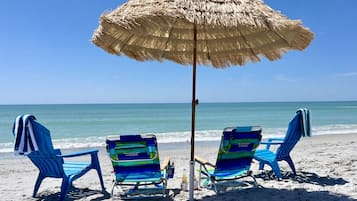 On the beach, sun loungers, beach towels