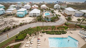 A resort with multiple buildings, a swimming pool, and a beach view. - Indies 704 | 3BR/2BA Penthouse Condo | Sleeps 9 | Gulf Views & Heated Pool (GULF SHORES)